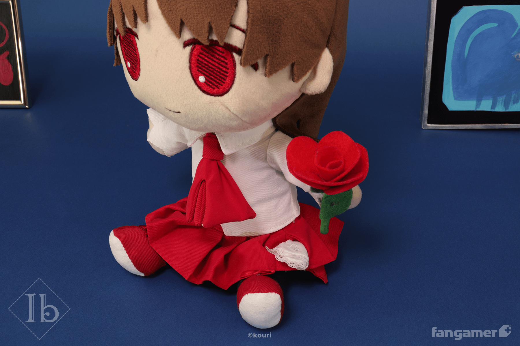 Official Ib plush holding the included red rose accessory. 