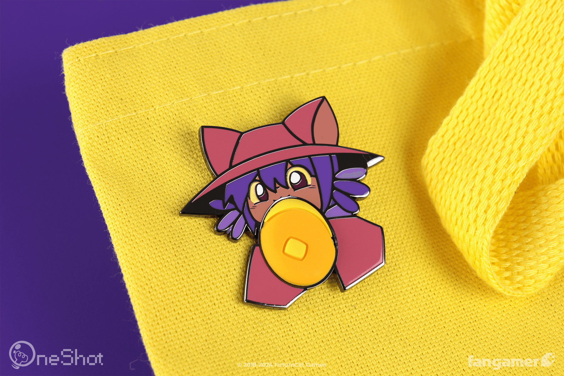 The Niko Loves Pancakes pin attached to a bright yellow tote bag and photographed against a purple background. Niko's sleeves and head (rendered in enamel) are visible as they take a bite of a very stretchy PVC pancake. 